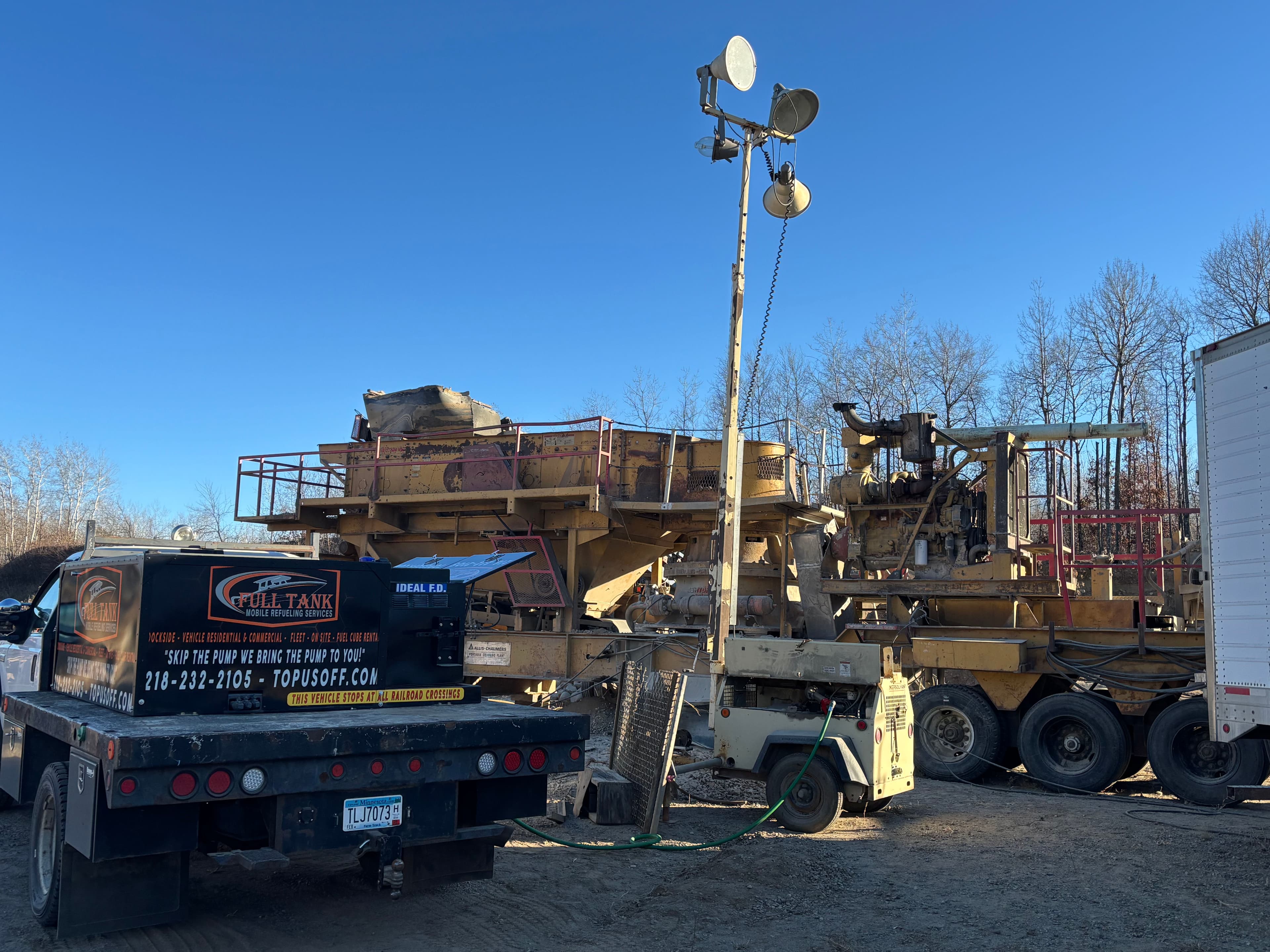 Project Nighttime Construction Illuminated with Full Tank Services image
